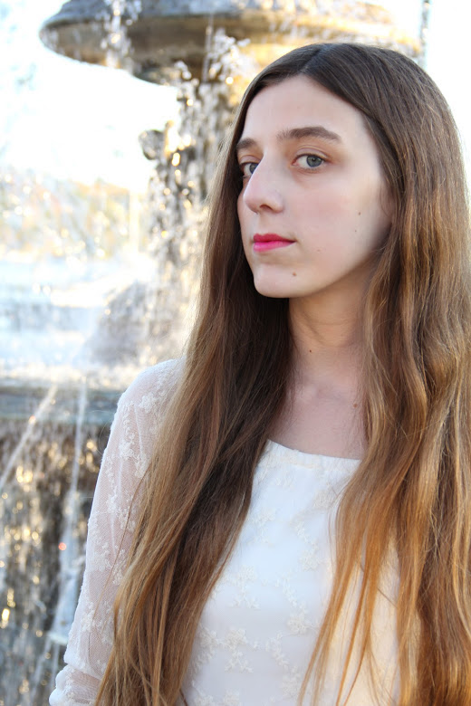 woman with long hair in a white top